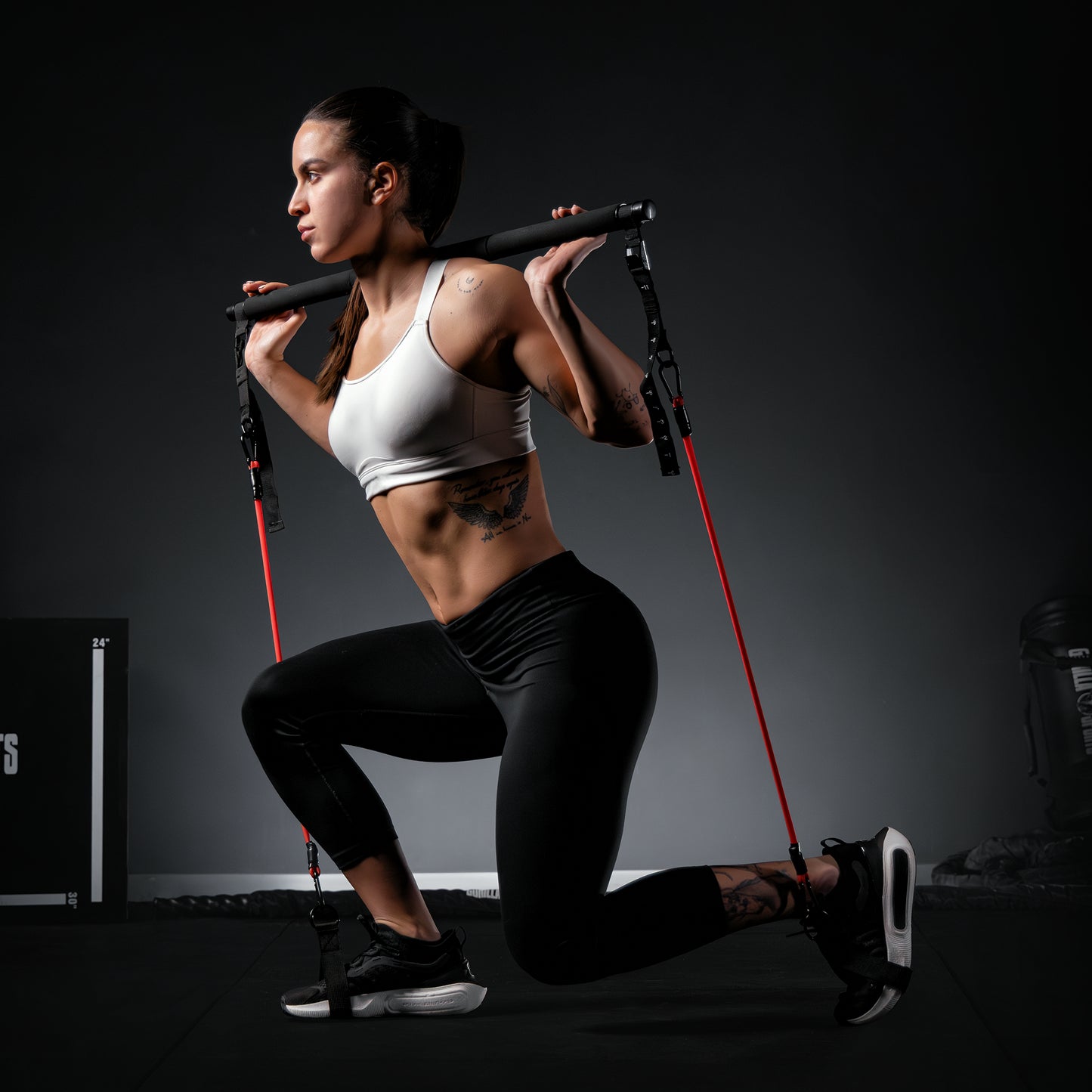 Set Pilates incluzând bară și benzi de rezistență